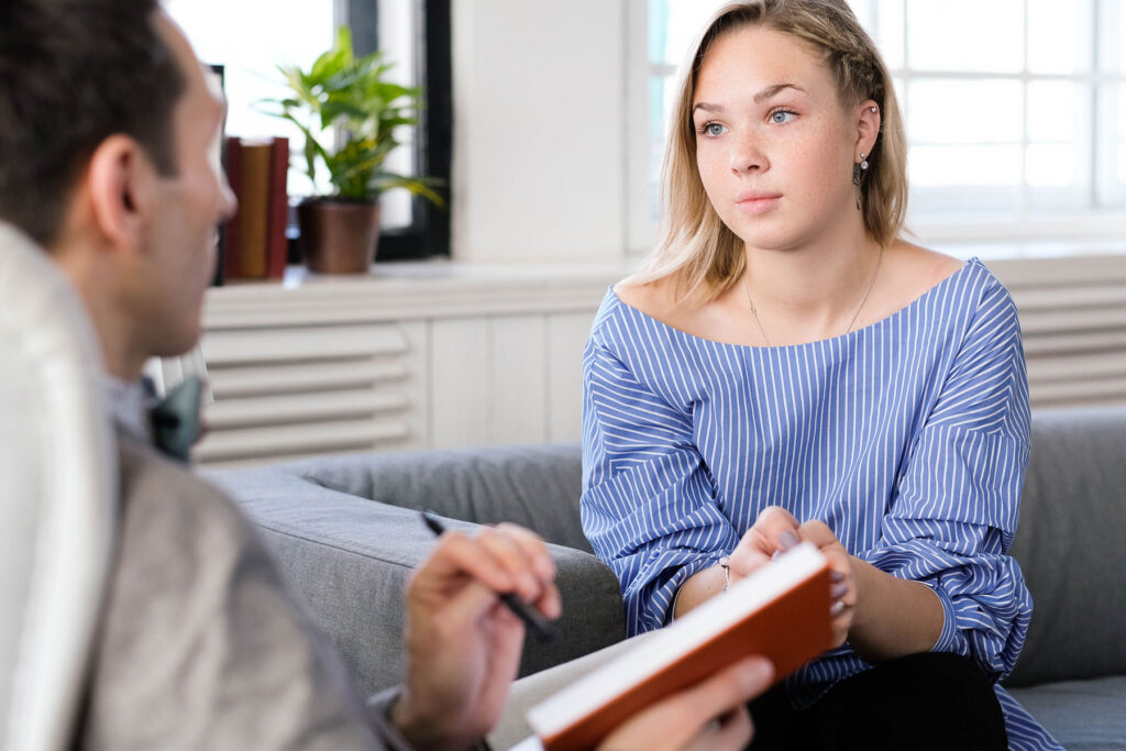 A woman wondering, "How much does therapy cost in Texas?"