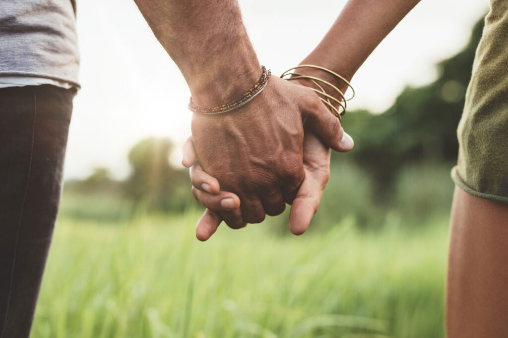 a couple holds hands after having worked to make a codependent relationship healthier