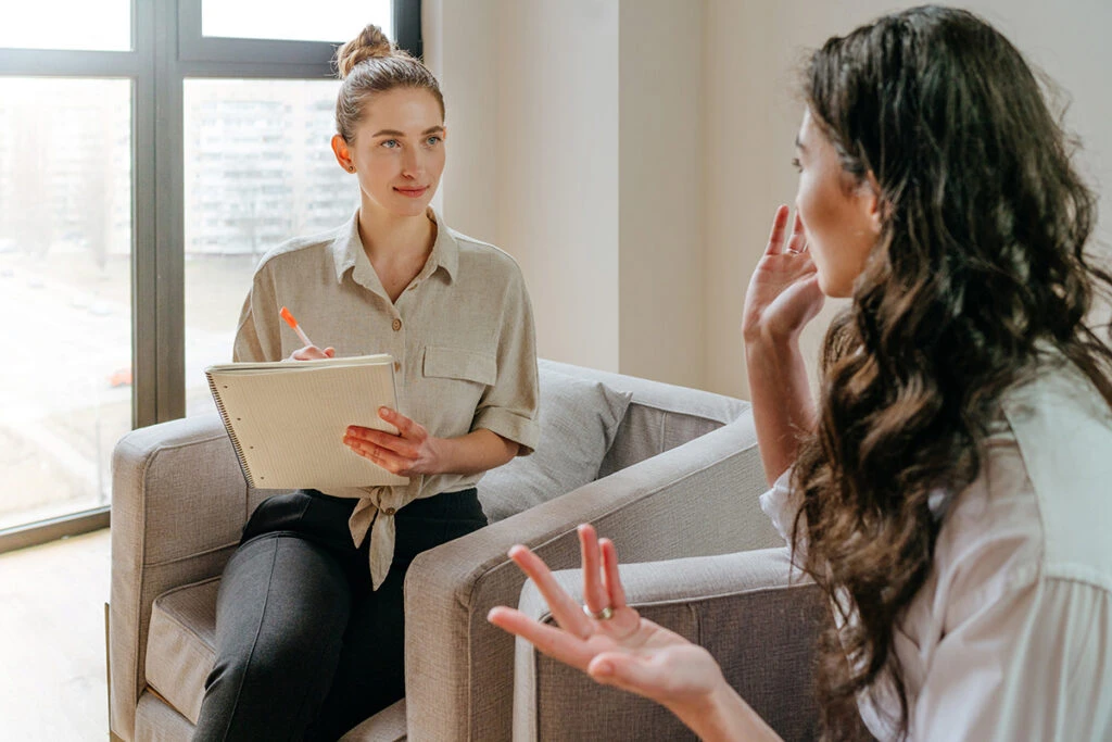a woman discusses length of stay in sober living with her advocate
